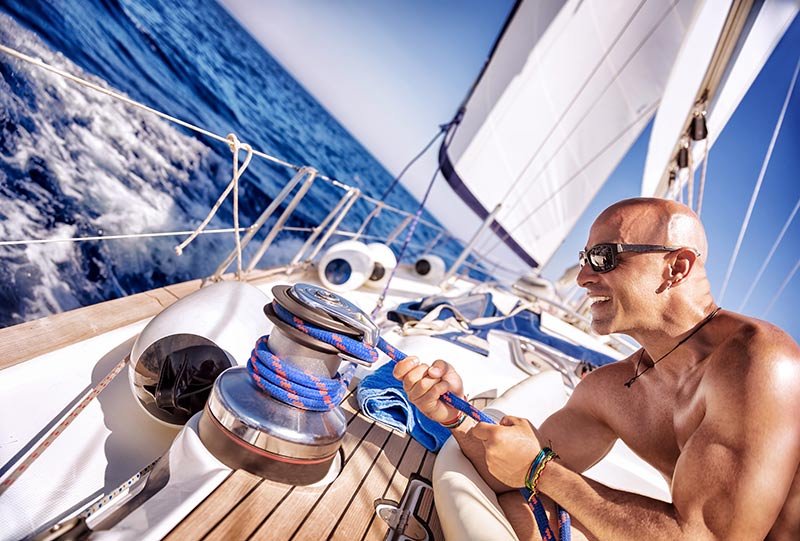 handsome-strong-man-working-on-sailboat-PYVQQJQ.jpg